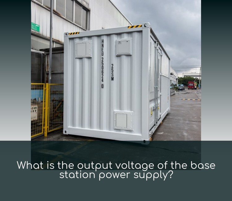 What is the output voltage of the base station power supply?